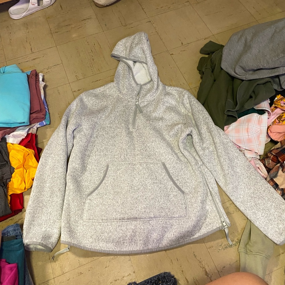 Fleece lined hooded half zip.